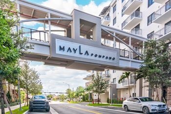 Controlled access parking garage with skybridge
